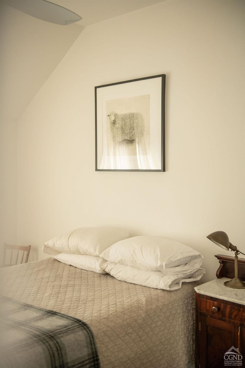 222 Main Street Germantown, NY 12526 - Photo 28 of 36 a bedroom with a bed and a painting on the wall