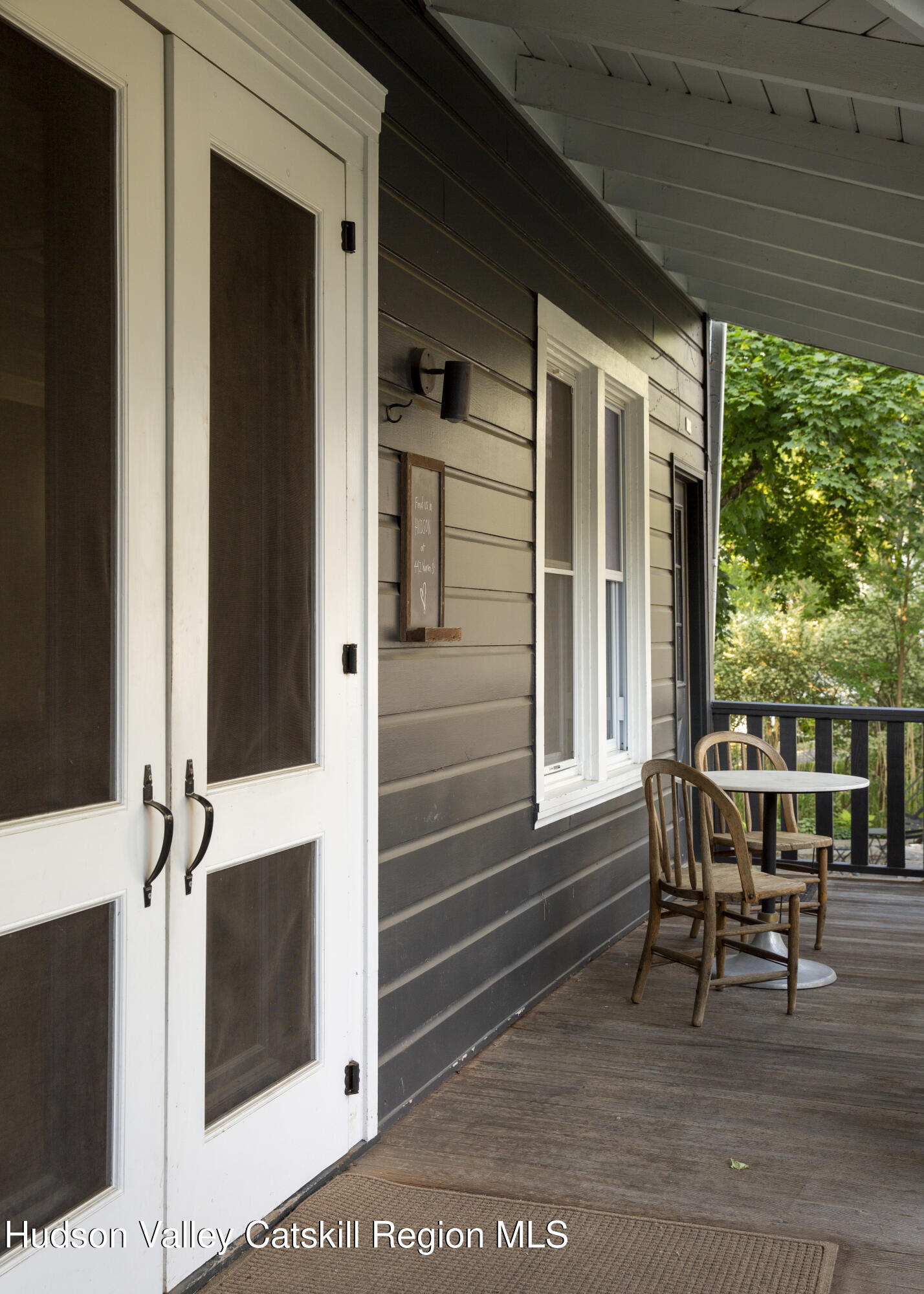 222 Main Street Germantown, NY 12526 - Photo 30 of 36 a patio with table and chairs and potted plants