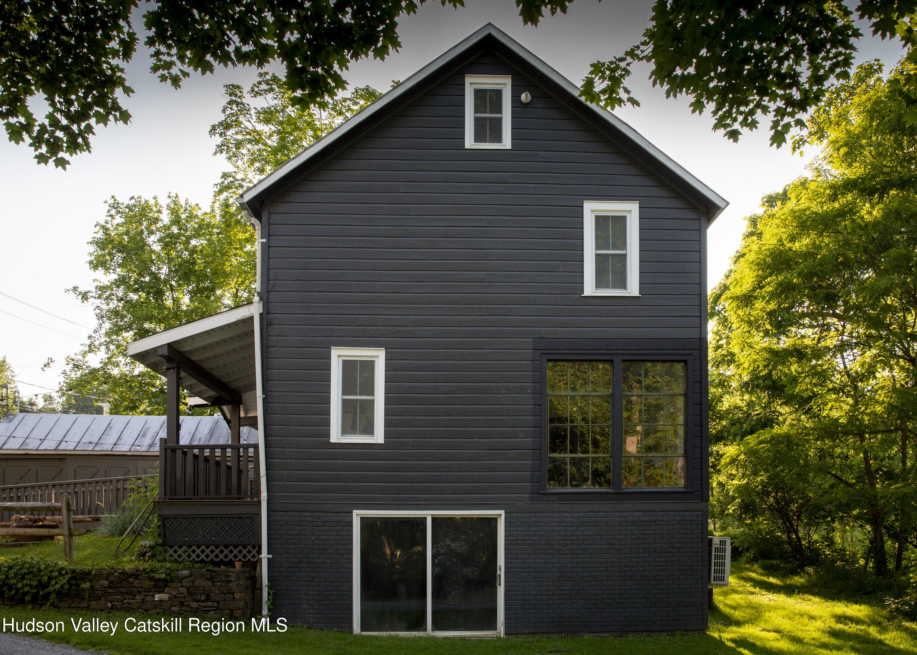 222 Main Street Germantown, NY 12526 - Photo 5 of 36 a front view of a house with garden