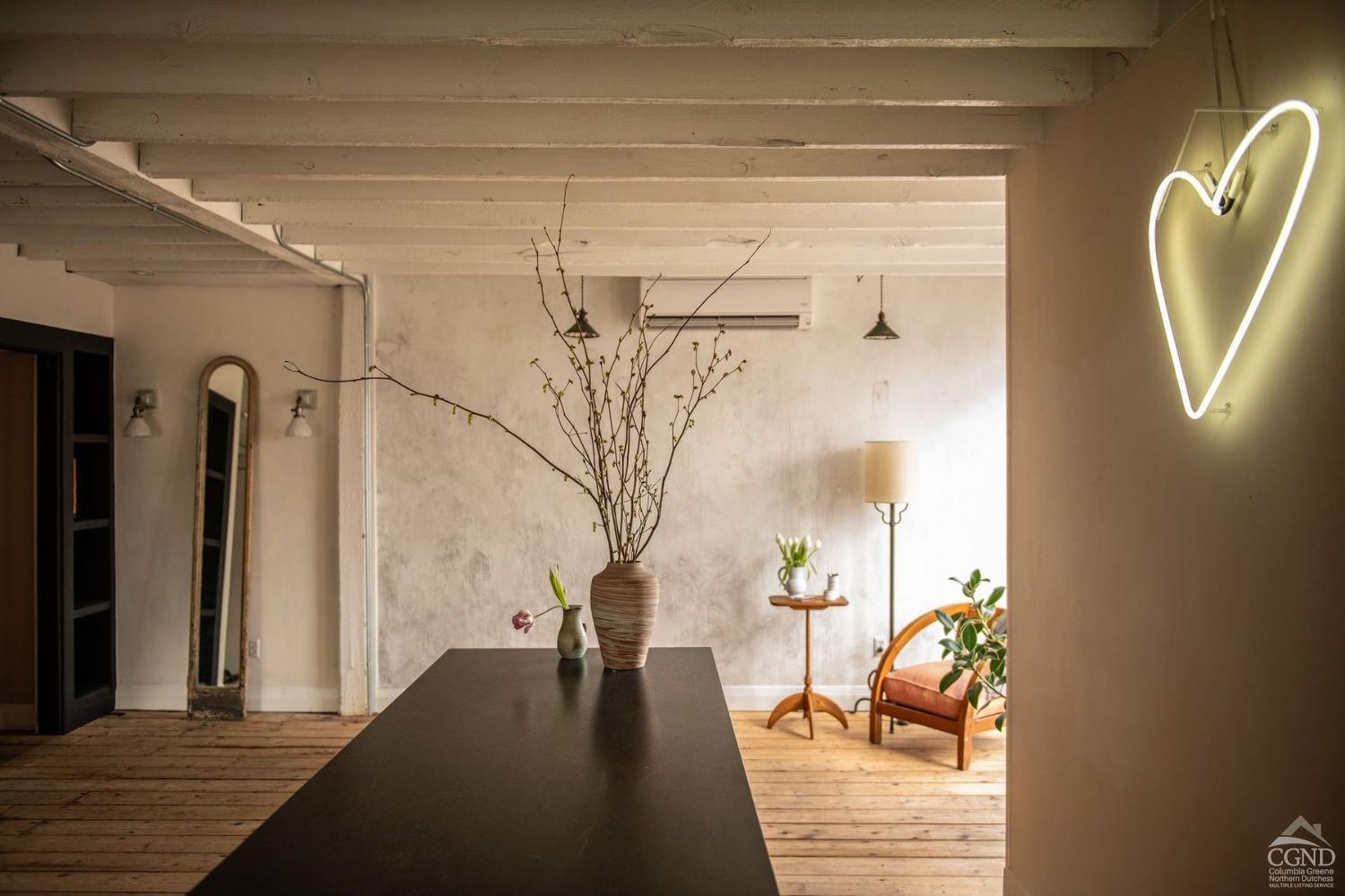 222 Main Street Germantown, NY 12526 - Photo 6 of 36 a view of a hallway with wooden floor and a living room