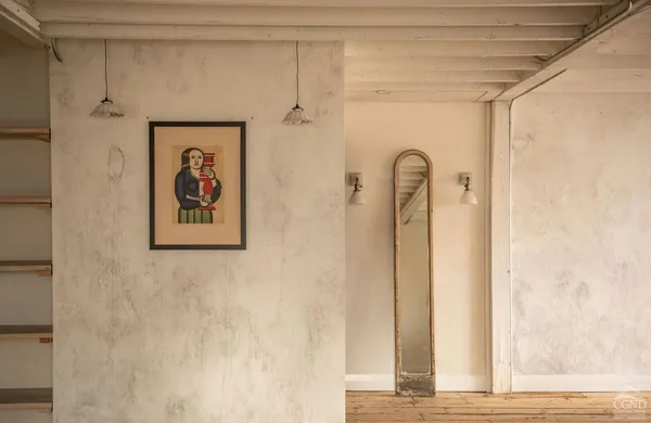 a view of a hallway with wooden door