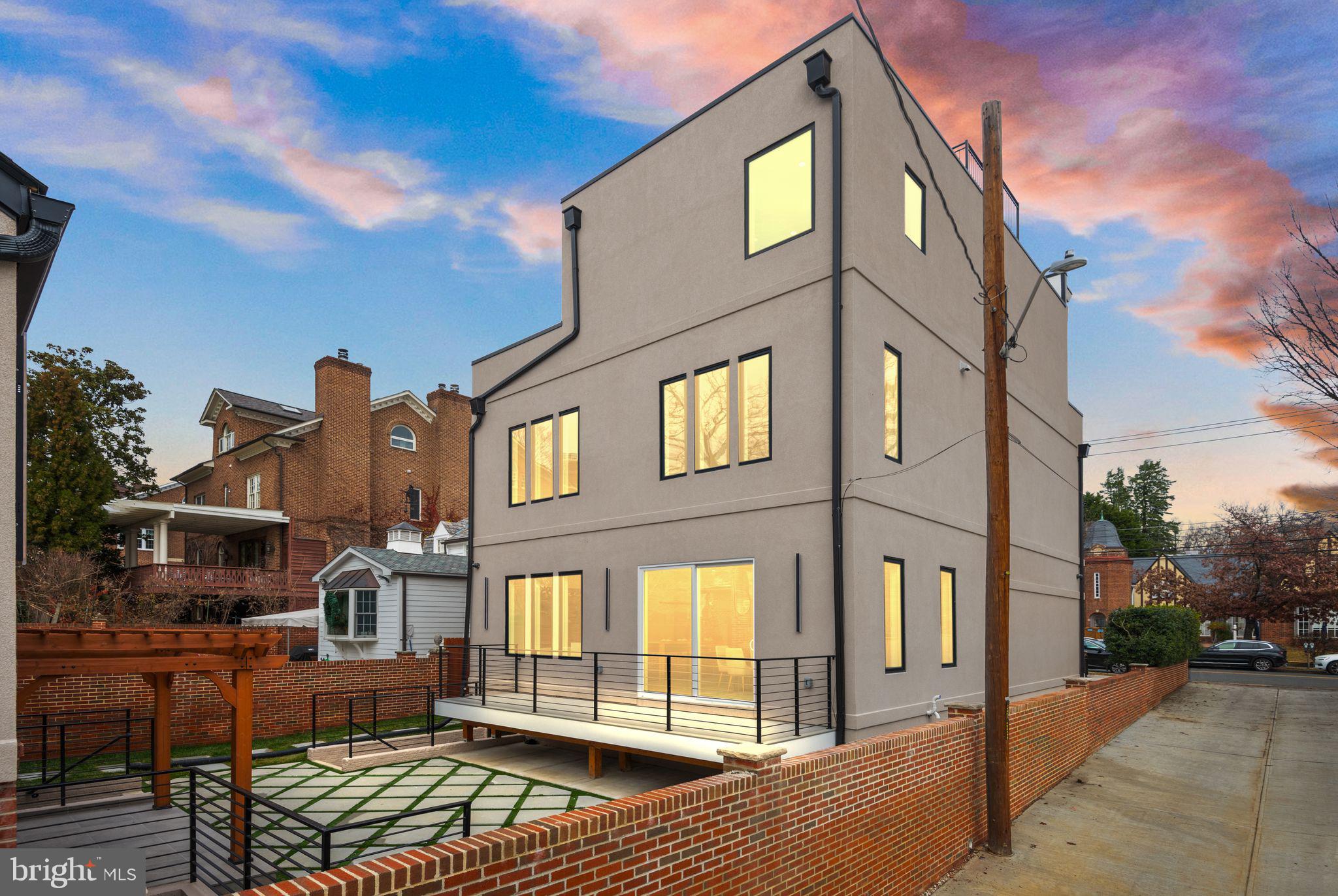 1610 Foxhall Road Northwest Washington, DC 20007 - Photo 17 of 66 a front view of a house with large windows