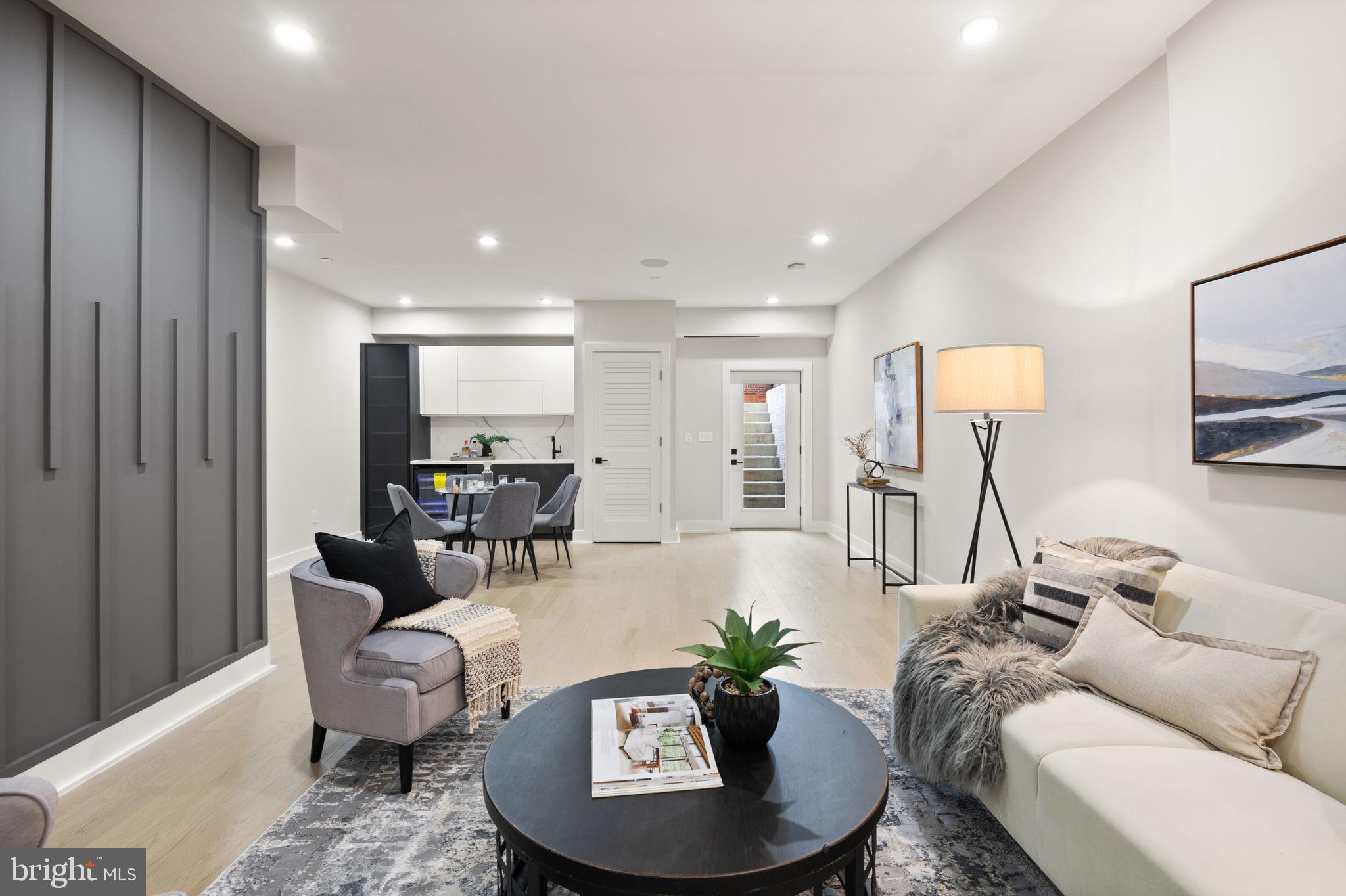 1610 Foxhall Road Northwest Washington, DC 20007 - Photo 23 of 66 a living room with furniture and a wooden floor