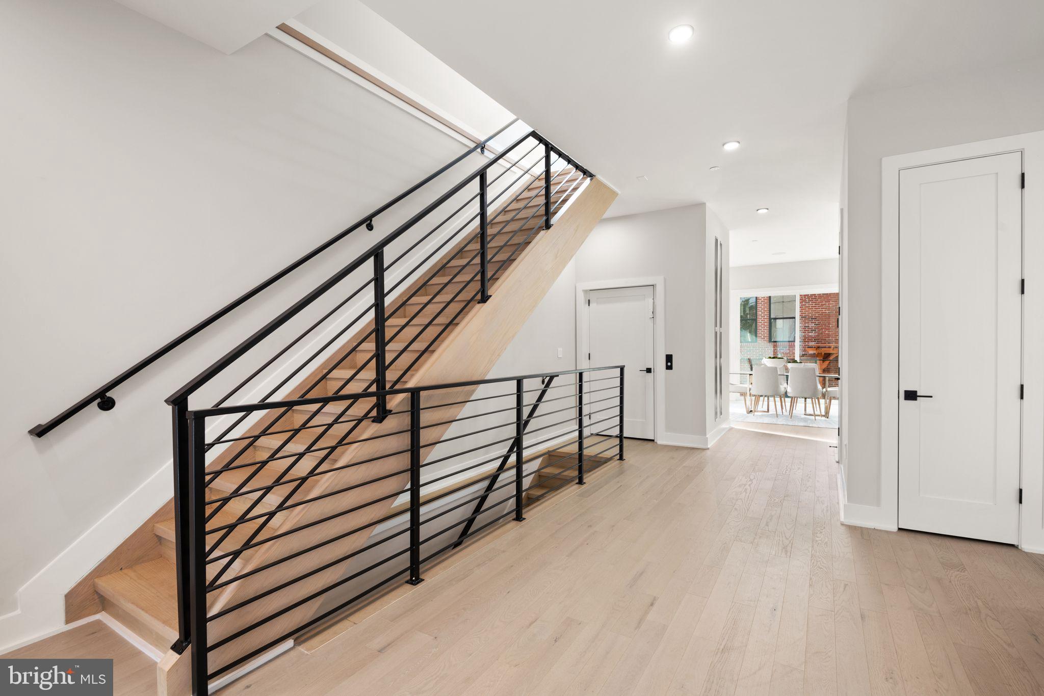 1610 Foxhall Road Northwest Washington, DC 20007 - Photo 27 of 66 a view of entryway with wooden floor and stairs