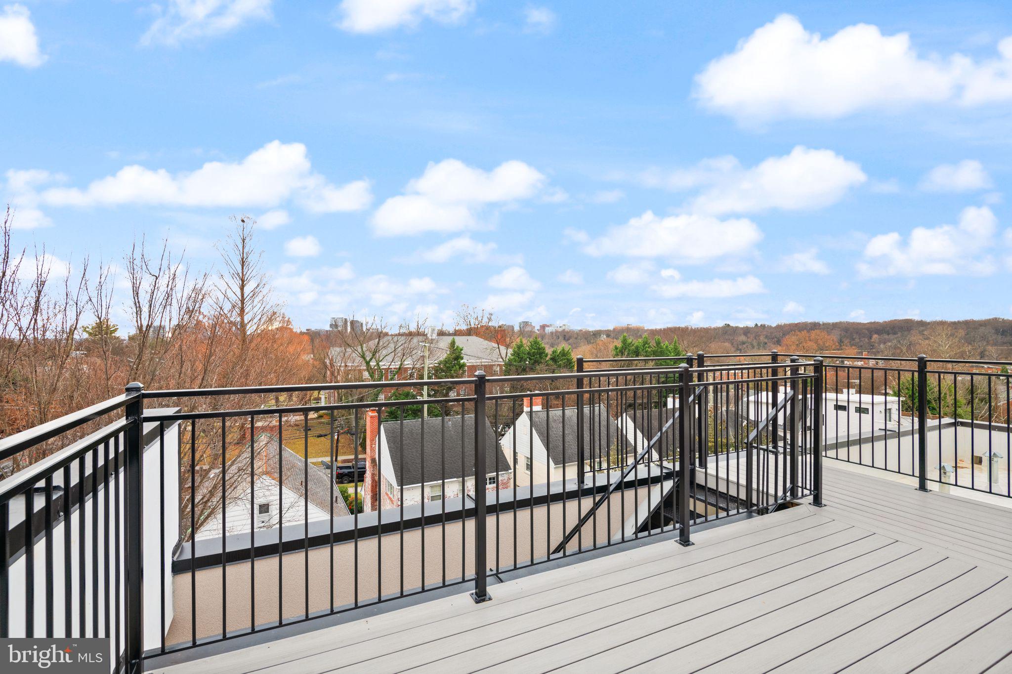 1610 Foxhall Road Northwest Washington, DC 20007 - Photo 49 of 66 a view of a balcony with wooden floor & fence