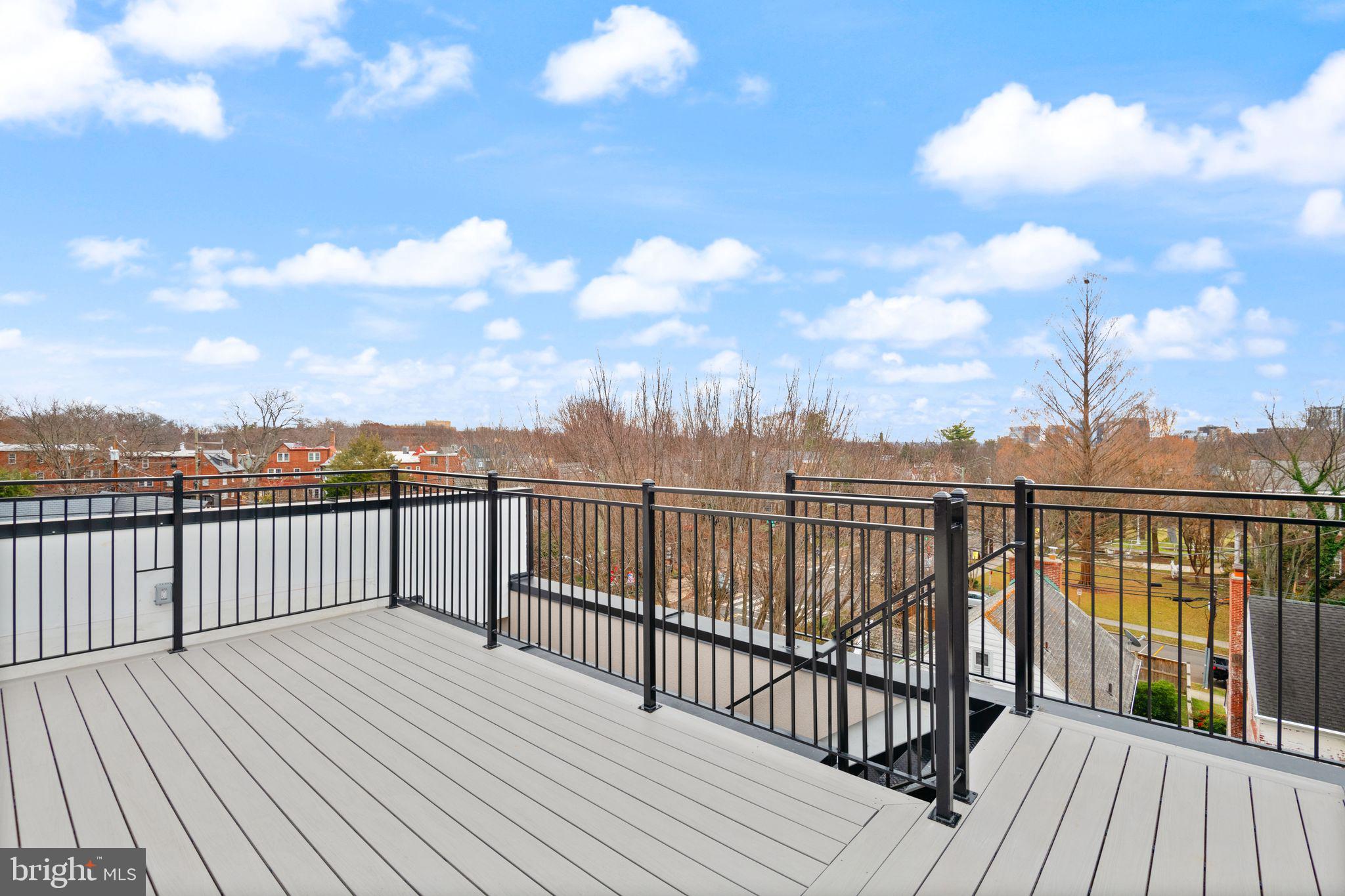 1610 Foxhall Road Northwest Washington, DC 20007 - Photo 50 of 66 a view of city from a roof deck