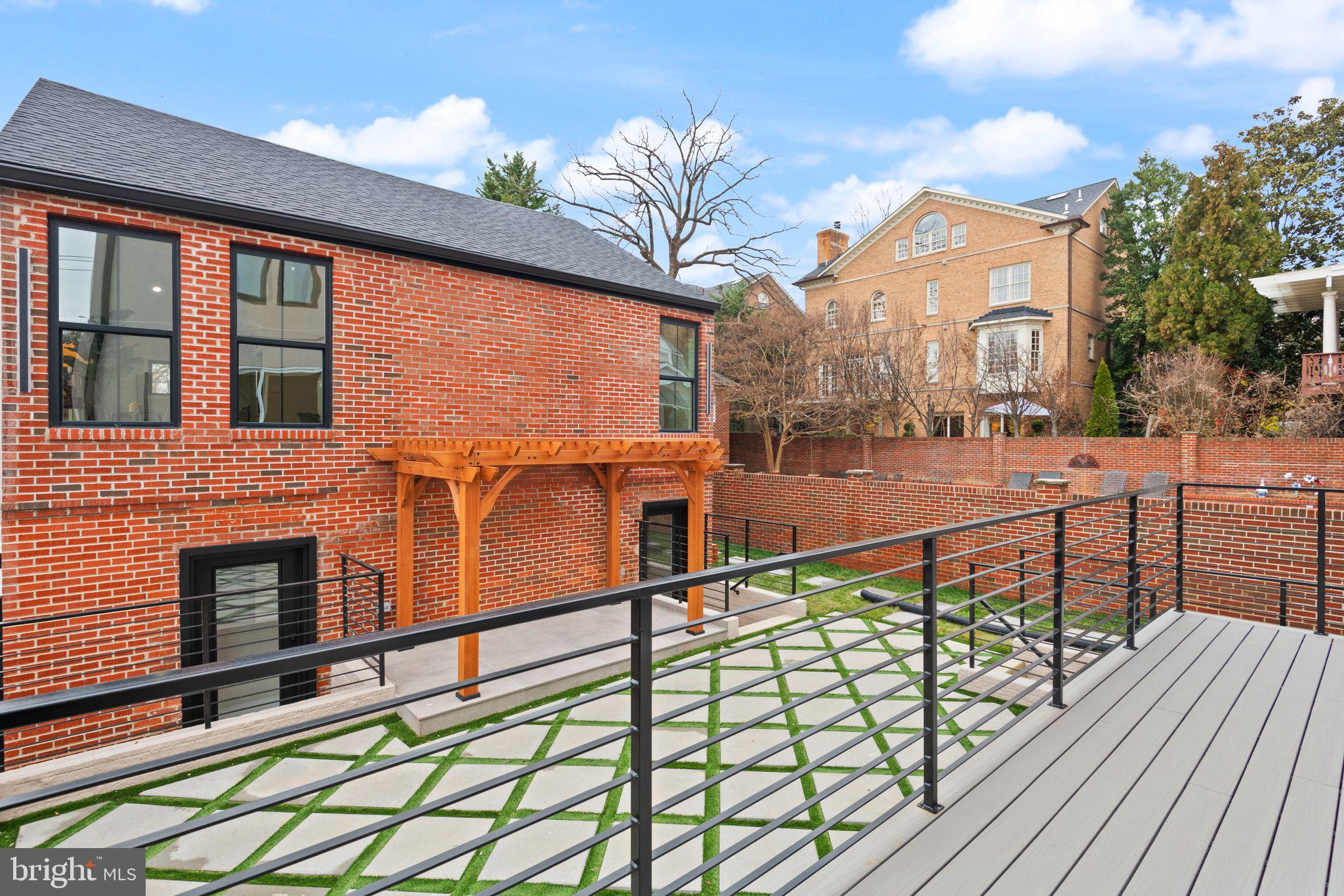 1610 Foxhall Road Northwest Washington, DC 20007 - Photo 51 of 66 a view of a brick house with many windows