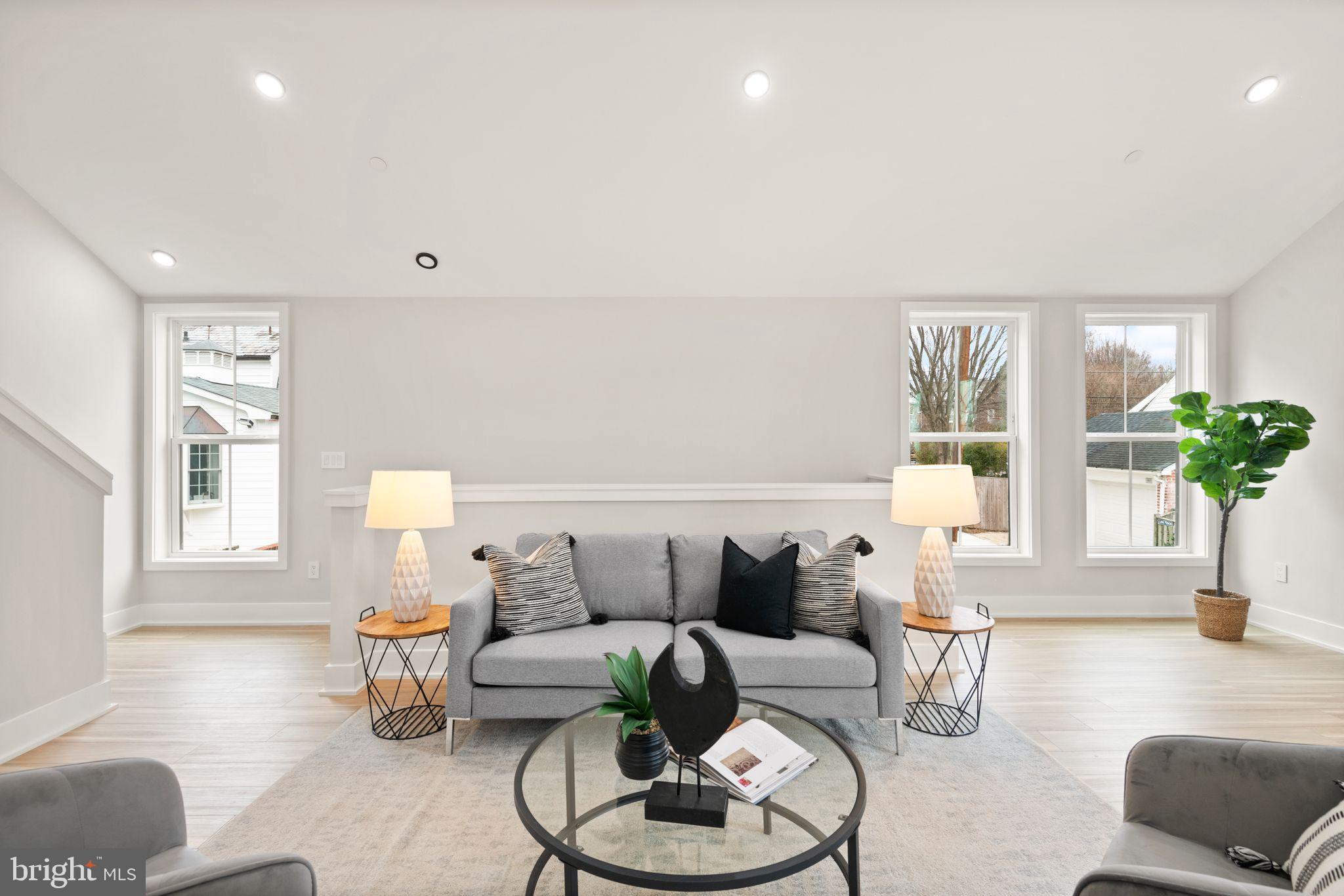 1610 Foxhall Road Northwest Washington, DC 20007 - Photo 54 of 66 a living room with furniture and a potted plant