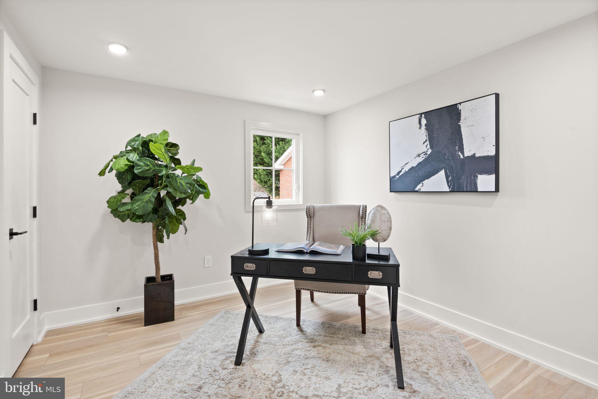 1610 Foxhall Road Northwest Washington, DC 20007 - Photo 58 of 66 a living room with furniture plant and a window