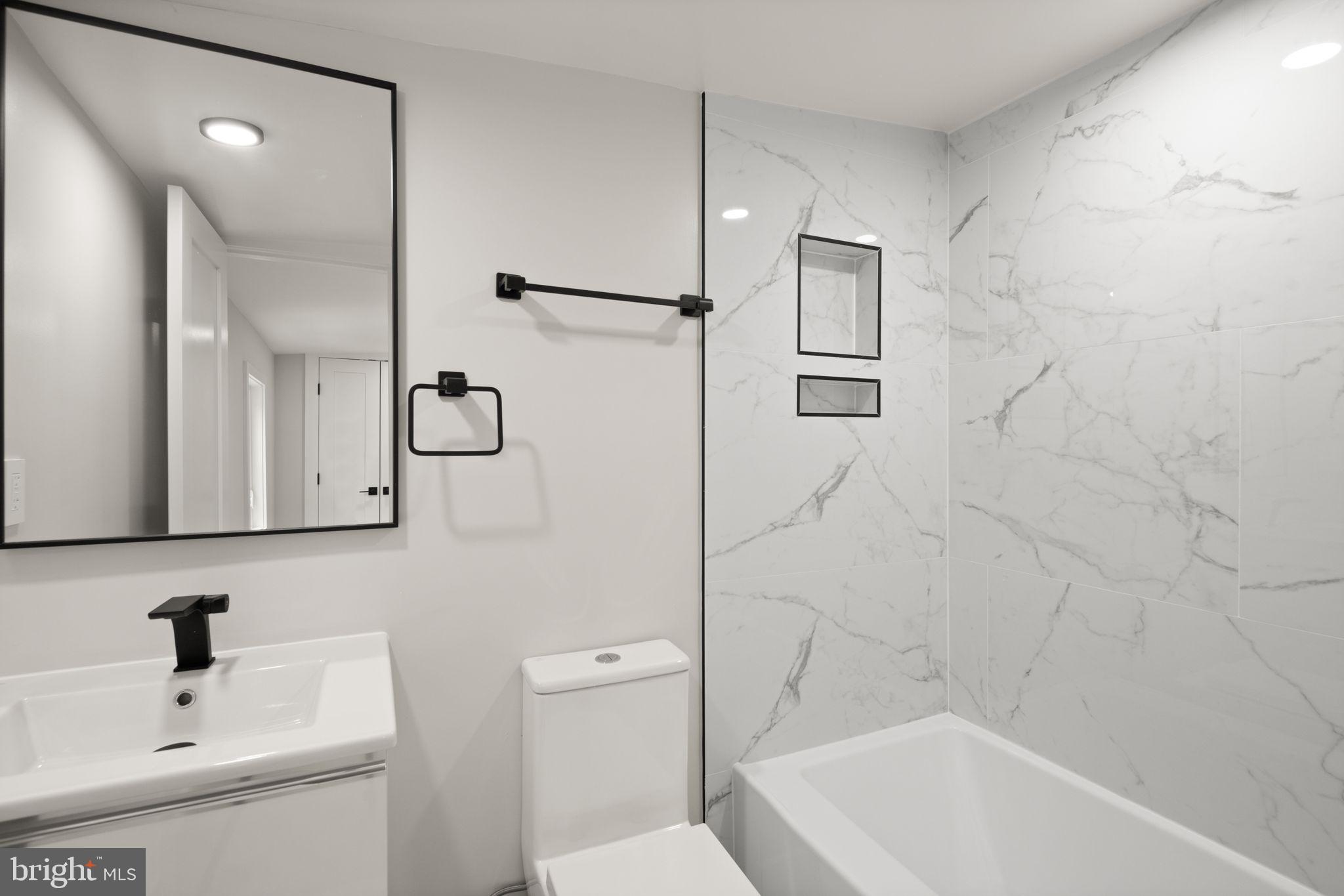 1610 Foxhall Road Northwest Washington, DC 20007 - Photo 61 of 66 a bathroom with a sink a toilet and shower