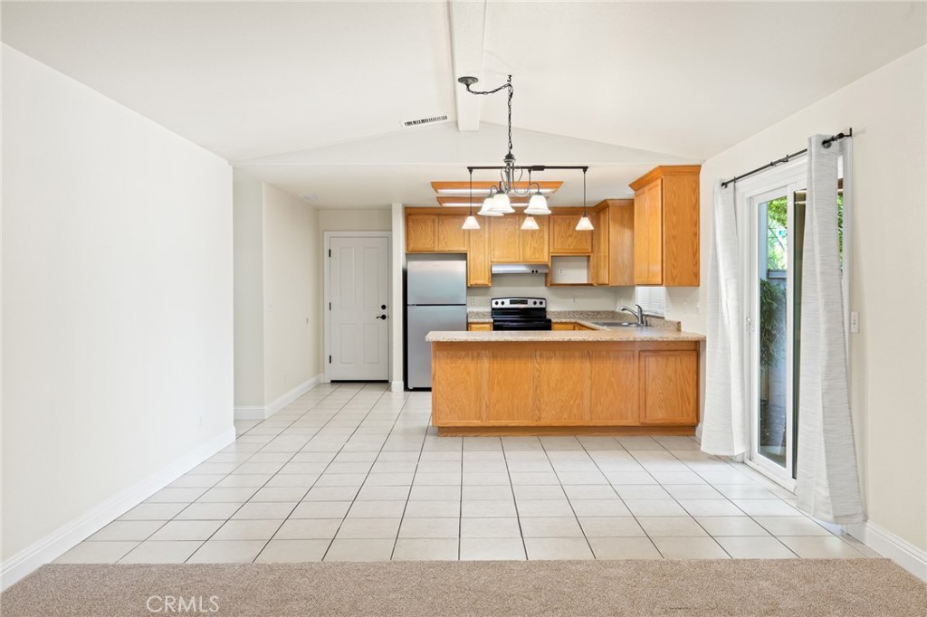 38 Kobe Loop Chico, CA 95973 - Photo 7 of 38 a kitchen with stainless steel appliances granite countertop a sink and cabinets