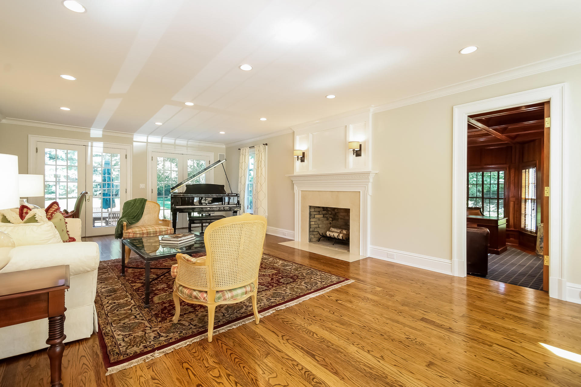 170 Brushy Ridge Road New Canaan, CT 06840 - Photo 11 of 56 a living room with furniture a fireplace and wooden floor