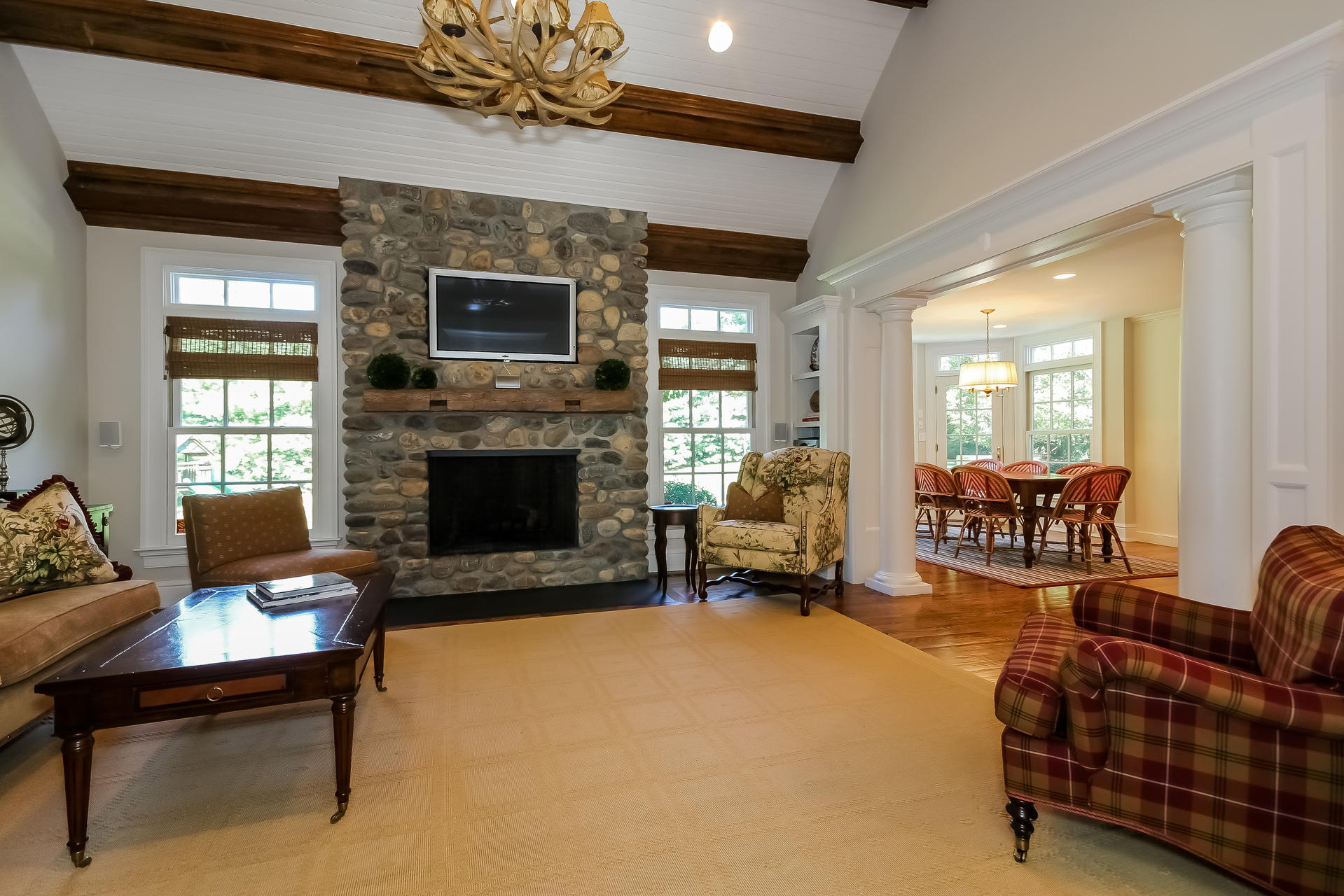 170 Brushy Ridge Road New Canaan, CT 06840 - Photo 24 of 56 a living room with furniture and a fireplace