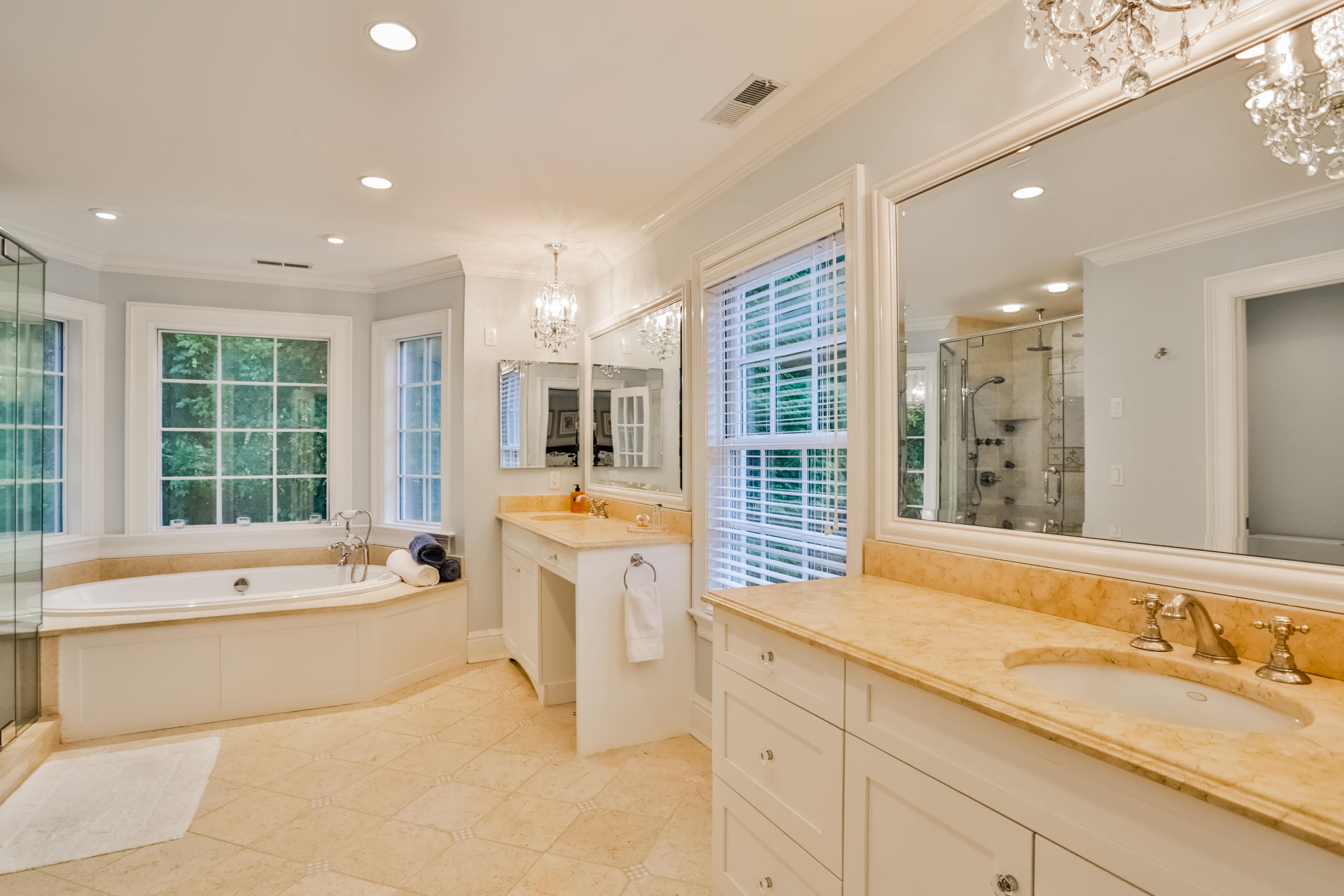 170 Brushy Ridge Road New Canaan, CT 06840 - Photo 31 of 56 a bathroom with a tub sink and mirror