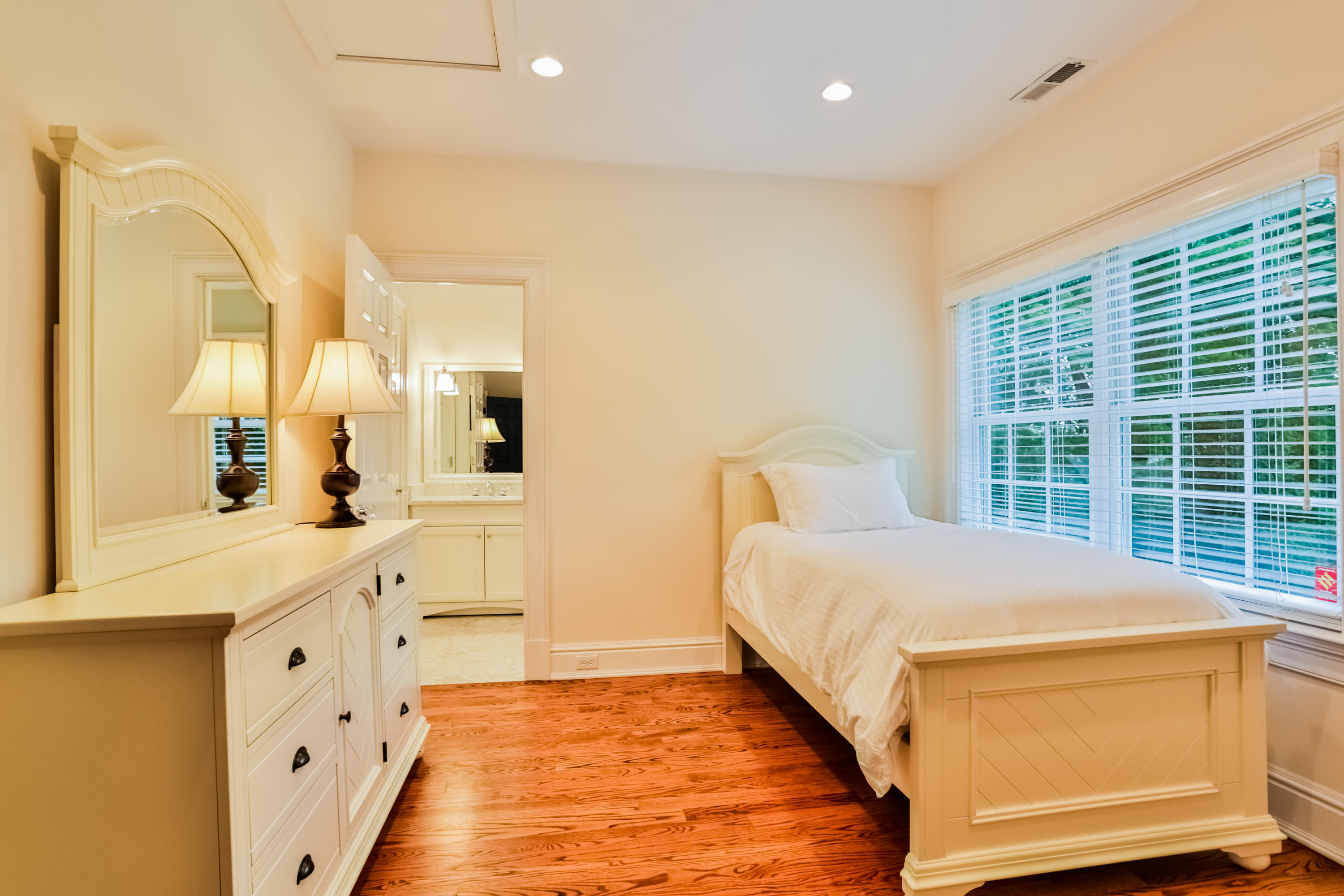 170 Brushy Ridge Road New Canaan, CT 06840 - Photo 41 of 56 a spacious bedroom with a large bed and a dresser