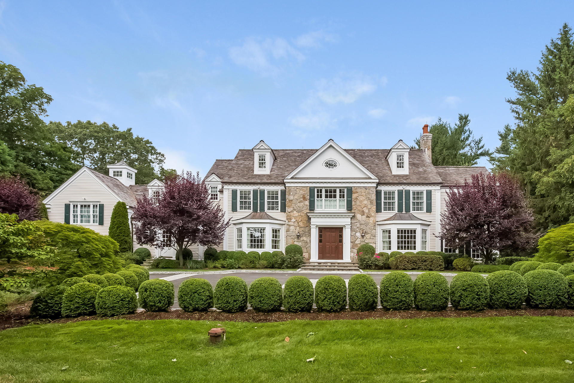 170 Brushy Ridge Road New Canaan, CT 06840 - Photo 6 of 56 a view of an house with a garden and plants