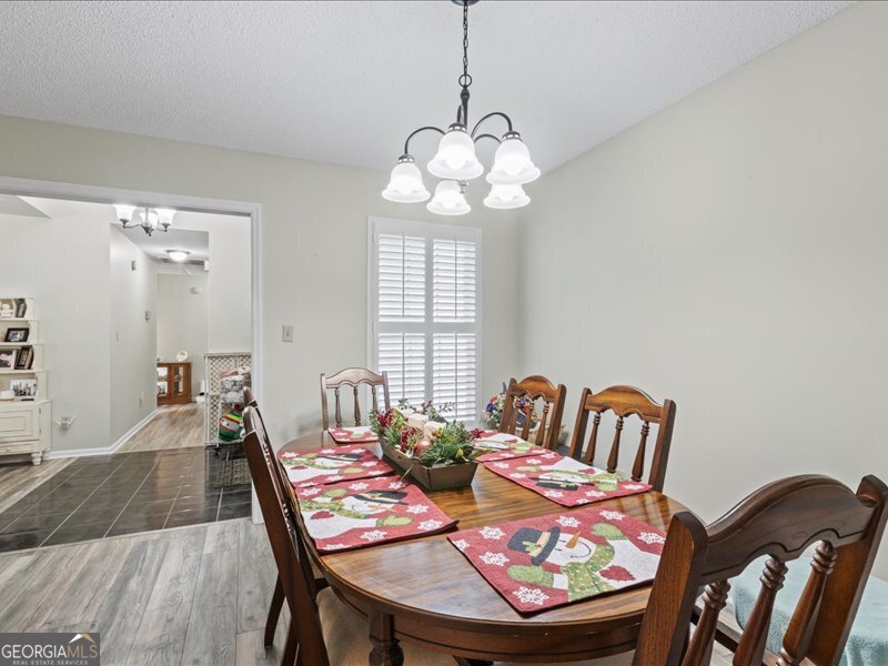 1508 Liberty Expressway Albany, GA 31705 - Photo 18 of 55 a view of a dining room with furniture wooden floor and chandelier