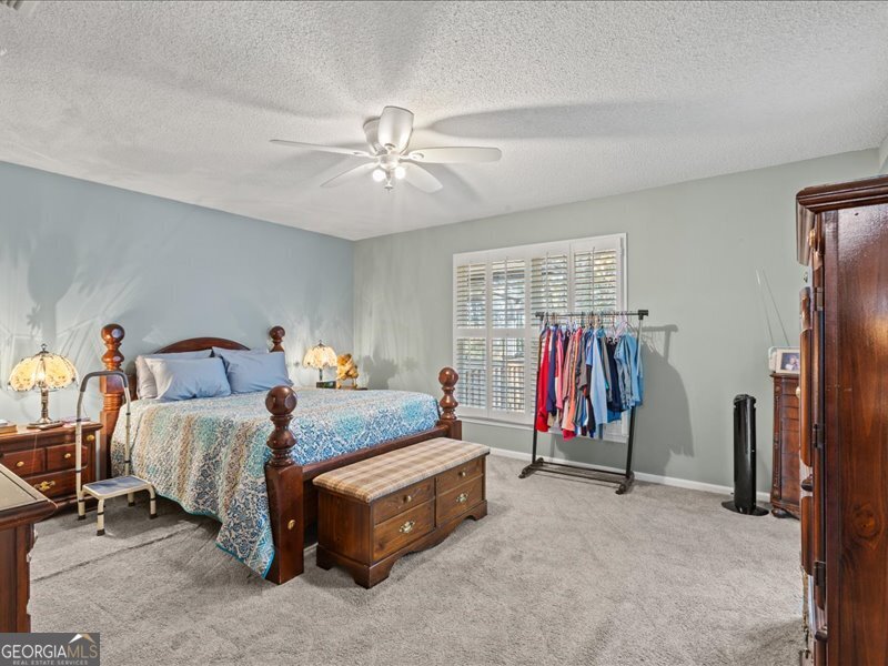 1508 Liberty Expressway Albany, GA 31705 - Photo 21 of 55 a bed room with a bed and a walk in closet