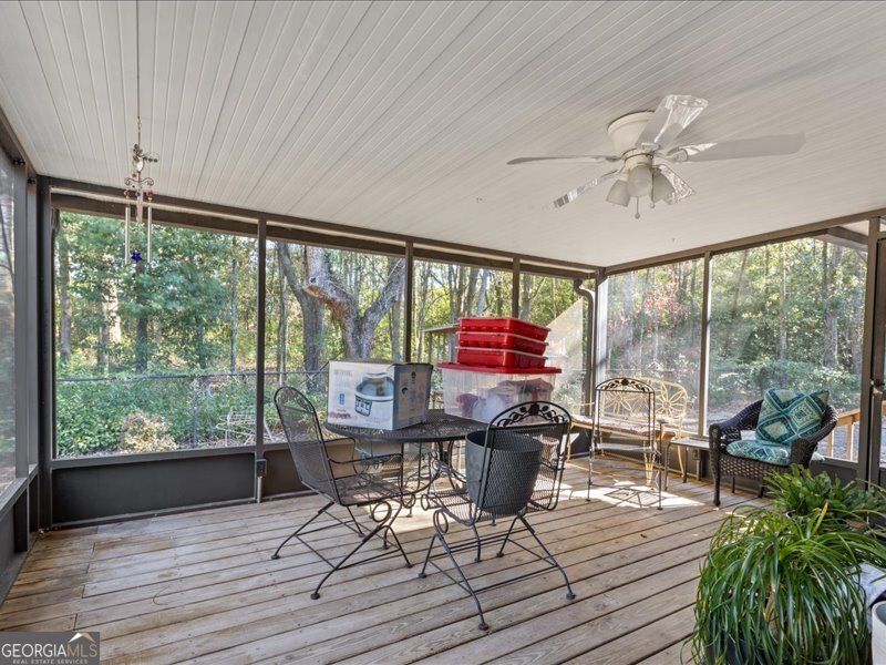 1508 Liberty Expressway Albany, GA 31705 - Photo 28 of 55 a living room with furniture a ceiling fan and a large window