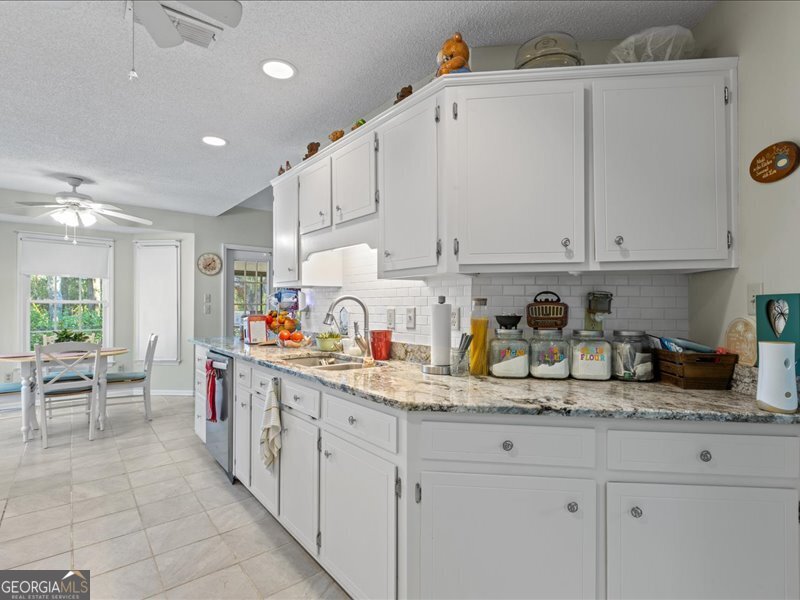 1508 Liberty Expressway Albany, GA 31705 - Photo 10 of 55 a kitchen with sink cabinets and window