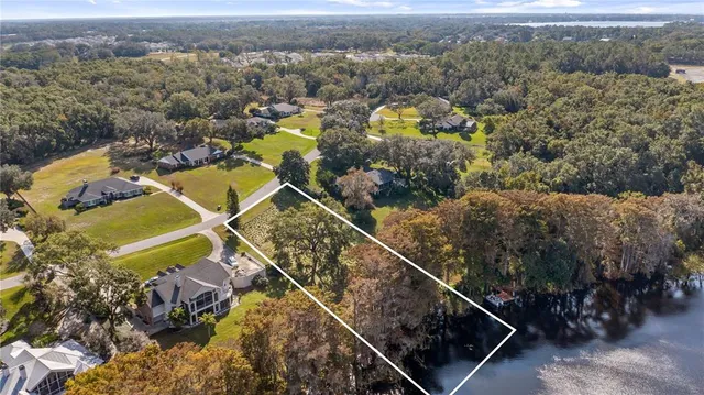 an aerial view of a residential houses with outdoor space