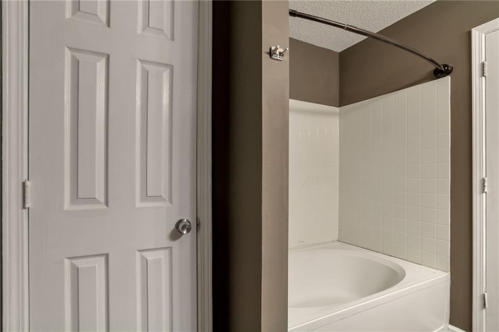 4598 Jackam Ridge Court Lithonia, GA 30038 - Photo 15 of 25 a bathroom with a bathtub