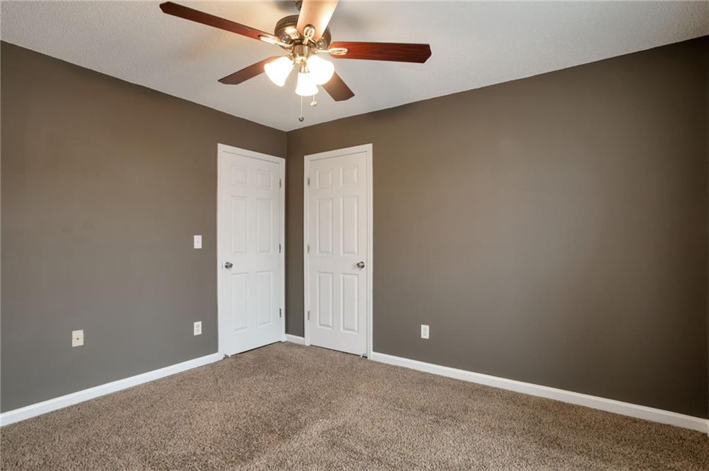 4598 Jackam Ridge Court Lithonia, GA 30038 - Photo 21 of 25 an empty room and chandelier fan