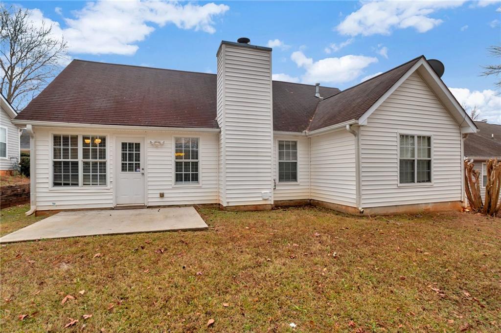 4598 Jackam Ridge Court Lithonia, GA 30038 - Photo 23 of 25 a view of a house with a yard