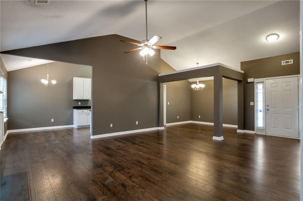 4598 Jackam Ridge Court Lithonia, GA 30038 - Photo 4 of 25 a view of an empty room with wooden floor and a room