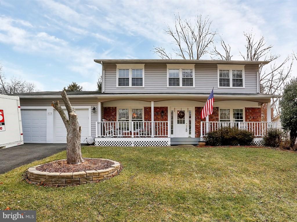 9115 Rockefeller Lane Springfield, VA 22153 - Photo 2 of 29 a front view of a house with a yard