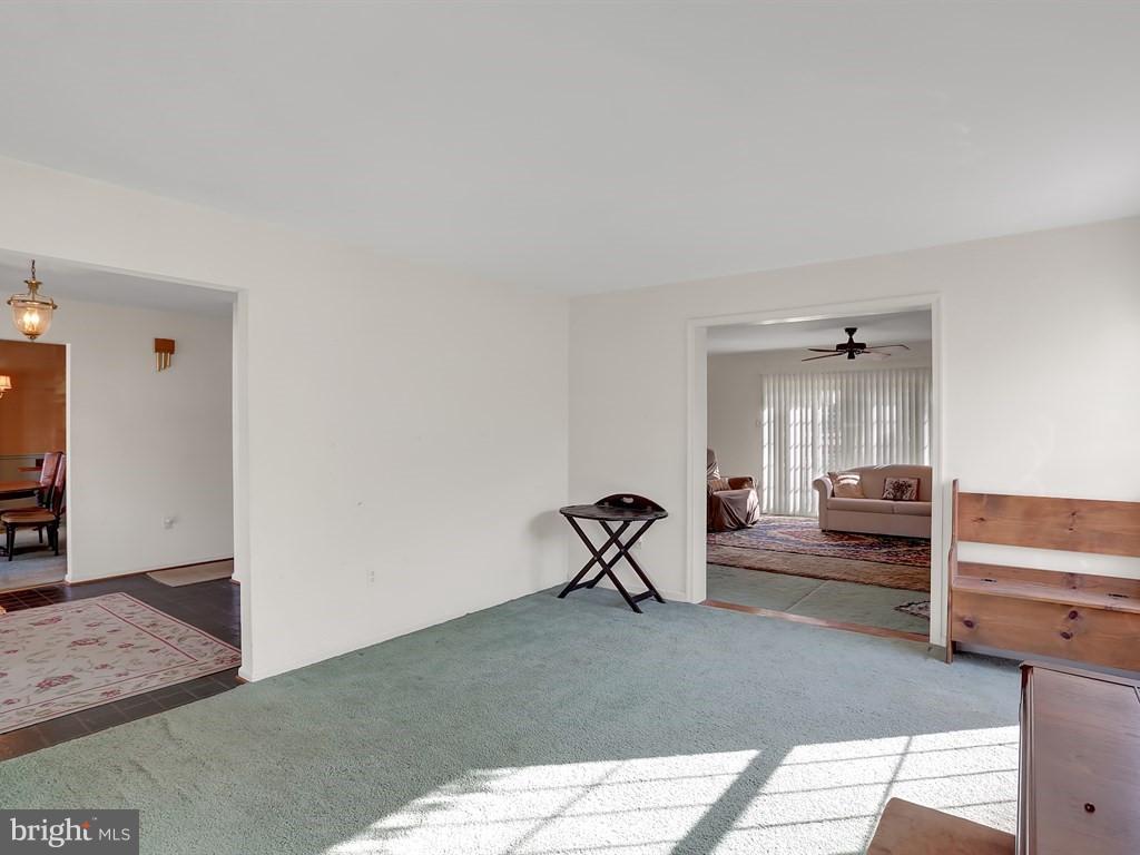 9115 Rockefeller Lane Springfield, VA 22153 - Photo 11 of 29 a living room with furniture and a flat screen tv