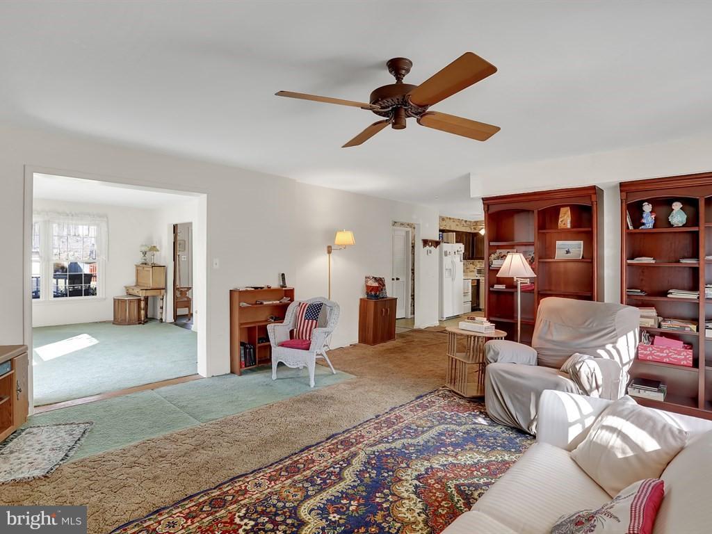 9115 Rockefeller Lane Springfield, VA 22153 - Photo 18 of 29 a bed room with furniture and a ceiling fan