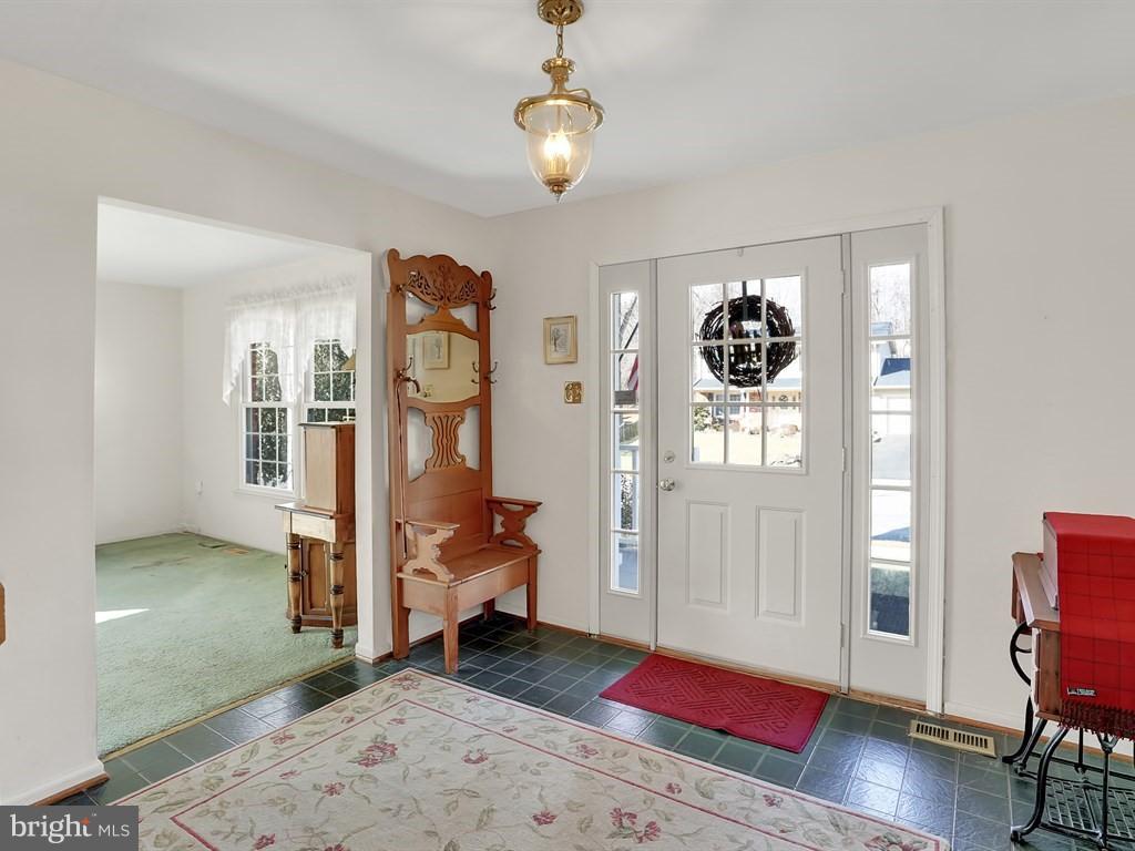 9115 Rockefeller Lane Springfield, VA 22153 - Photo 3 of 29 a view of a livingroom with furniture and wooden floor