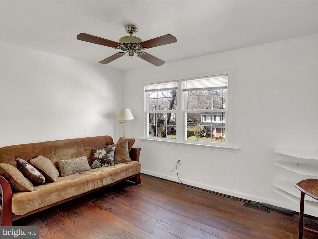 9115 Rockefeller Lane Springfield, VA 22153 - Photo 24 of 29 a living room with furniture and a window