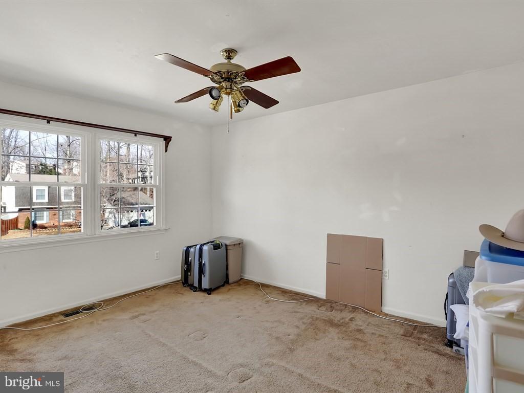 9115 Rockefeller Lane Springfield, VA 22153 - Photo 25 of 29 a view of an empty room with a window