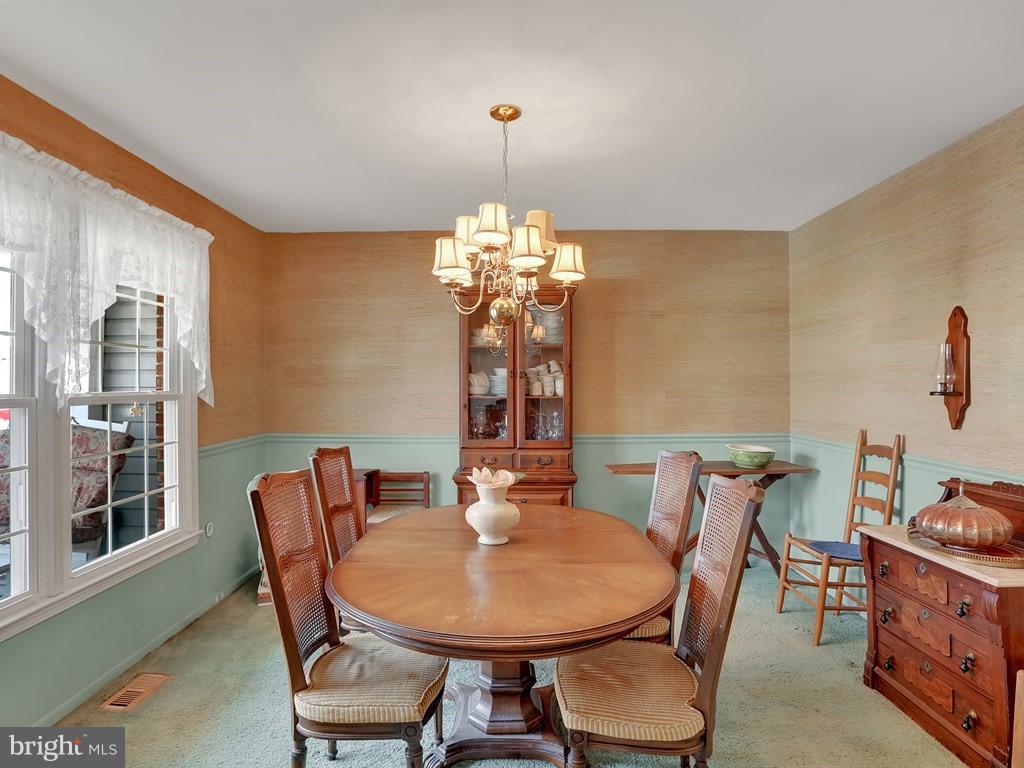 9115 Rockefeller Lane Springfield, VA 22153 - Photo 4 of 29 a dining room with furniture and window