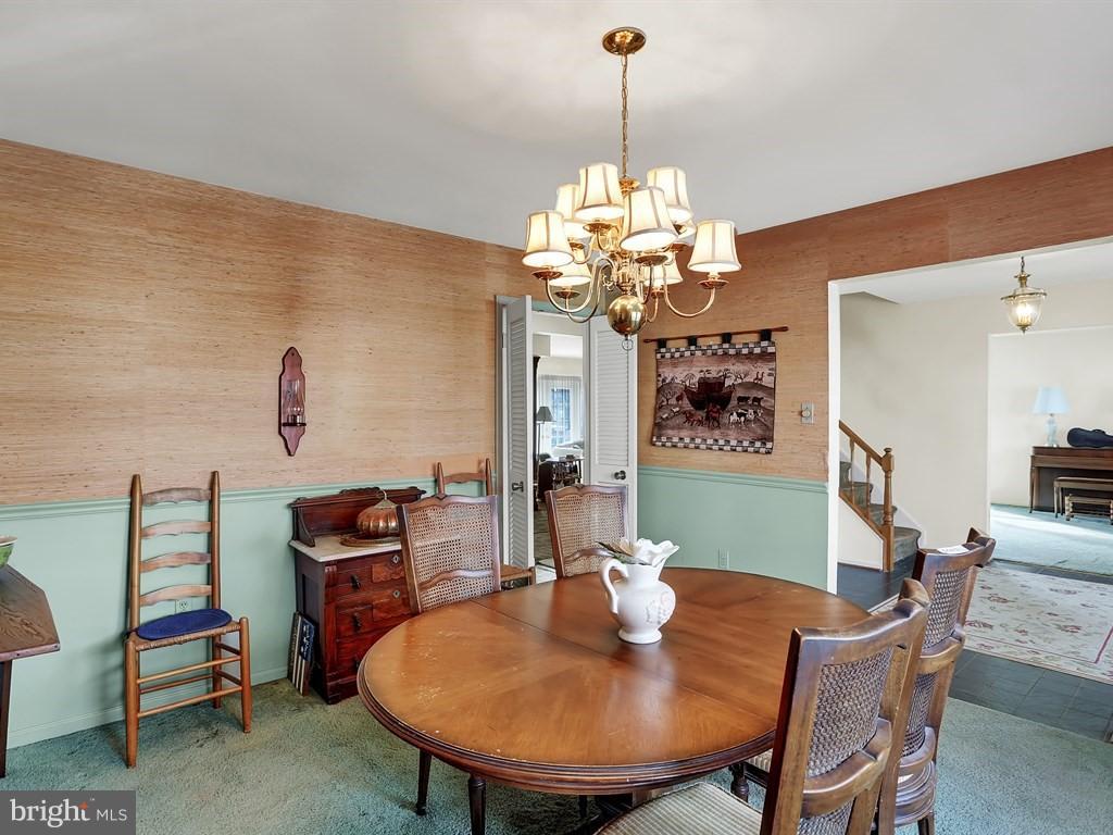 9115 Rockefeller Lane Springfield, VA 22153 - Photo 8 of 29 a view of a dining room with furniture