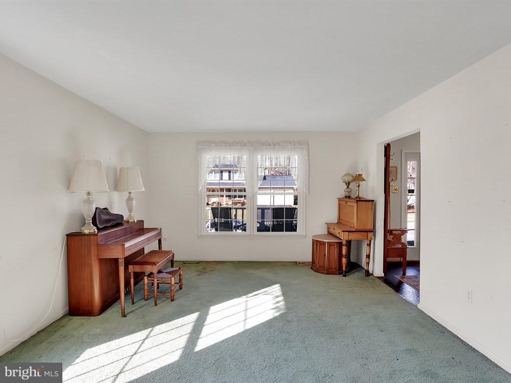 9115 Rockefeller Lane Springfield, VA 22153 - Photo 9 of 29 a living room with furniture and a window