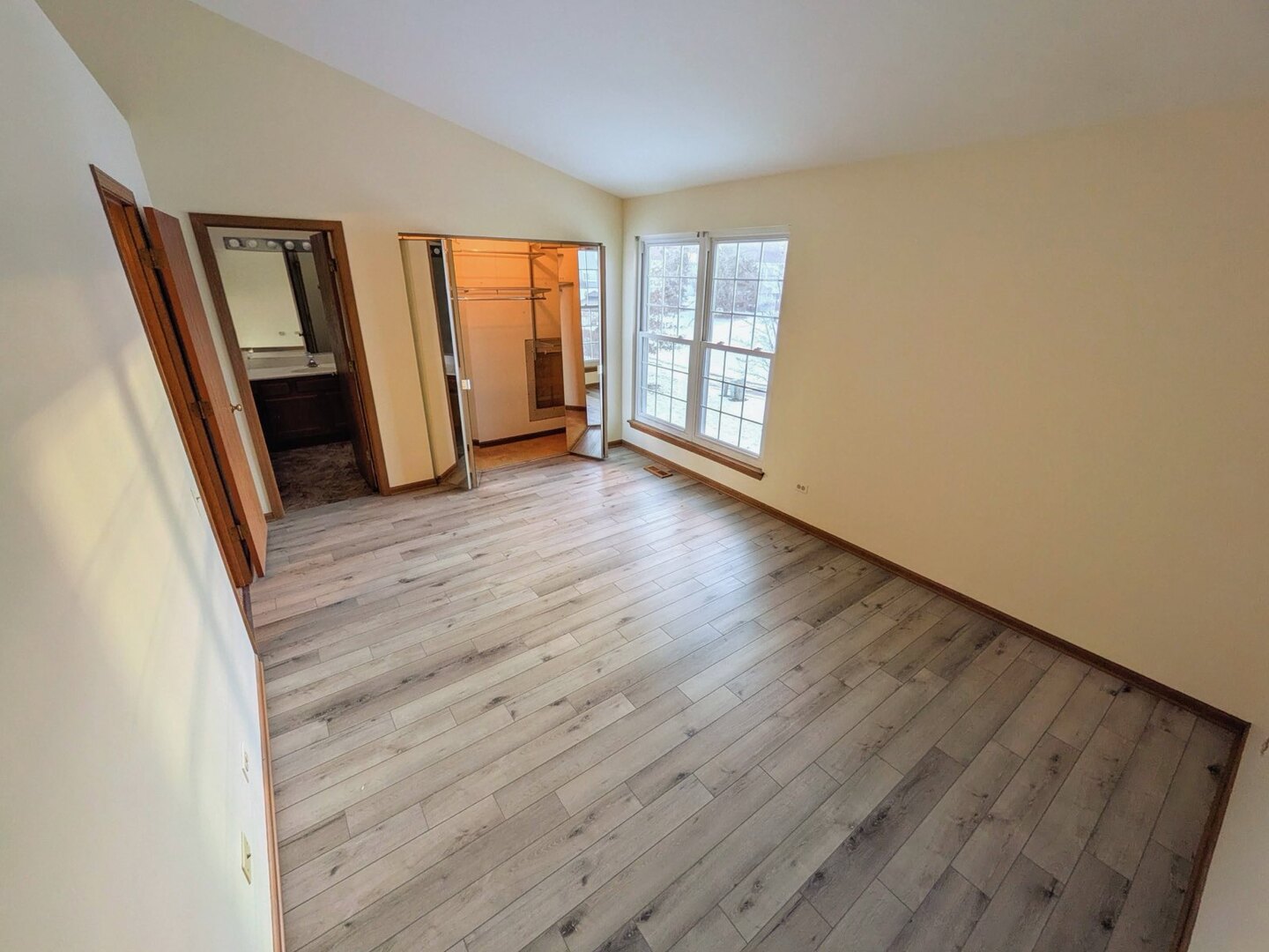 28 North Oltendorf Road, Unit 28 Streamwood, IL 60107 - Photo 12 of 13 wooden floor in an empty room with a window