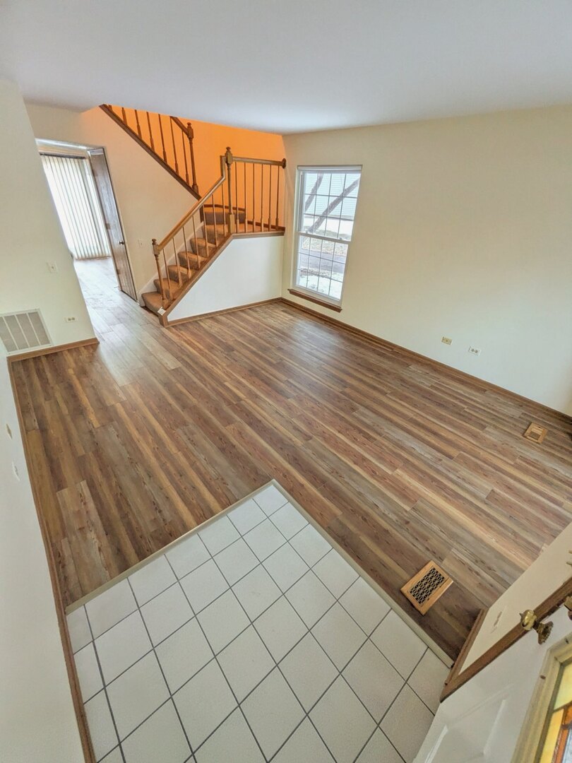 28 North Oltendorf Road, Unit 28 Streamwood, IL 60107 - Photo 2 of 13 a view of an empty room and wooden floor