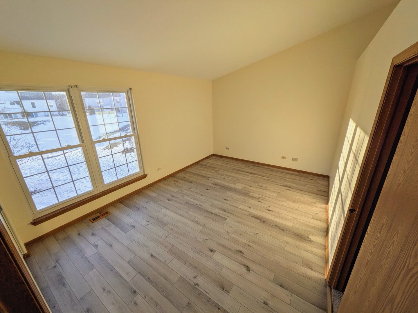 28 North Oltendorf Road, Unit 28 Streamwood, IL 60107 - Photo 9 of 13 a view of an empty room and wooden floor