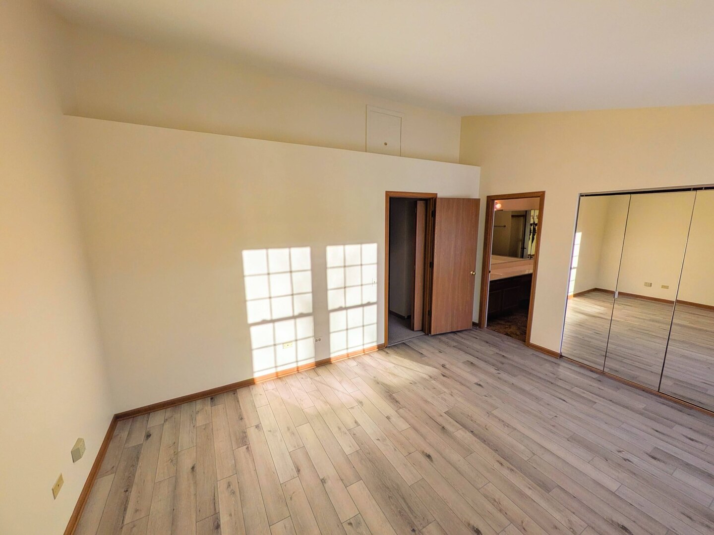 28 North Oltendorf Road, Unit 28 Streamwood, IL 60107 - Photo 10 of 13 an empty room with wooden floor and windows