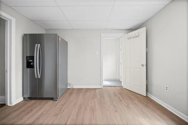 a view of hallway with wooden floor