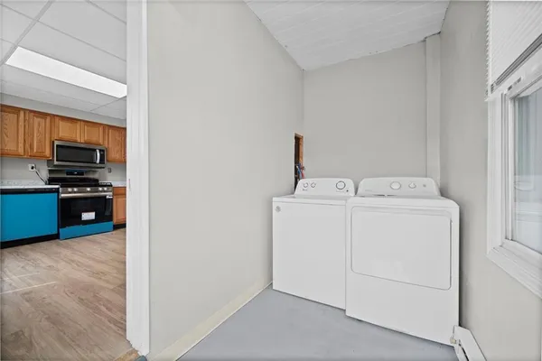 a utility room with dryer and washer
