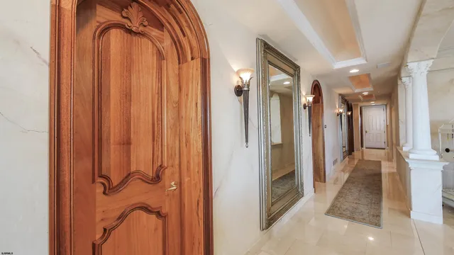 a bathroom with a granite countertop sink a toilet and a mirror