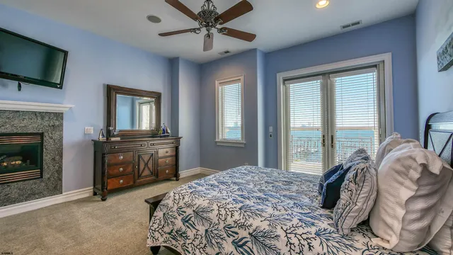 a bedroom with bed and a chandelier
