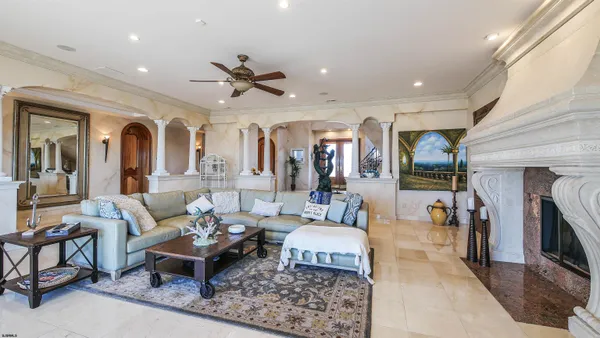 a kitchen with stainless steel appliances kitchen island granite countertop a stove a sink a oven a dining table and chairs