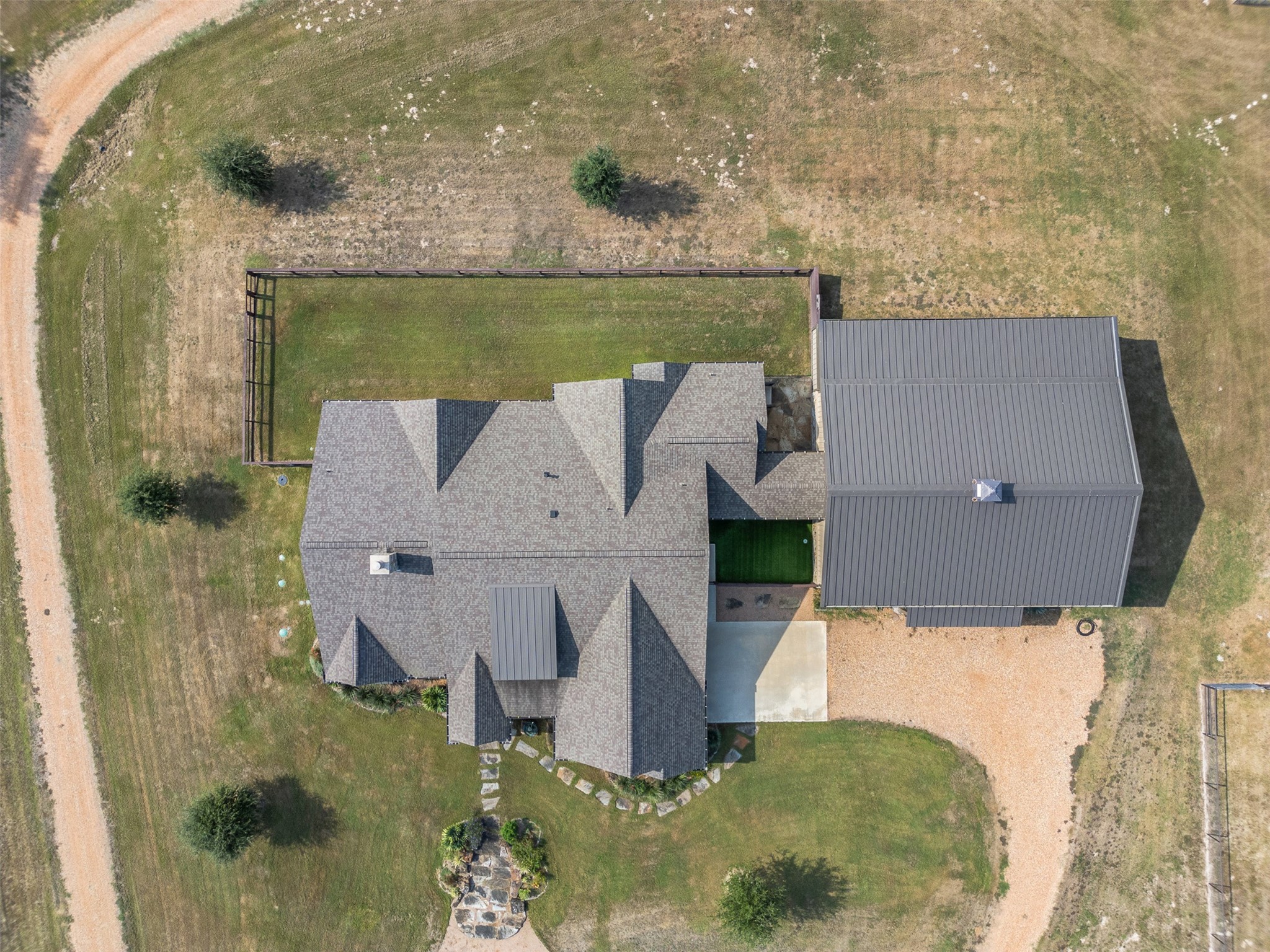 30163 High Spirit Ranch Road Hempstead, TX 77445 - Photo 32 of 46 Aerial shot above the house- the barn to the right is attached to the main residence.