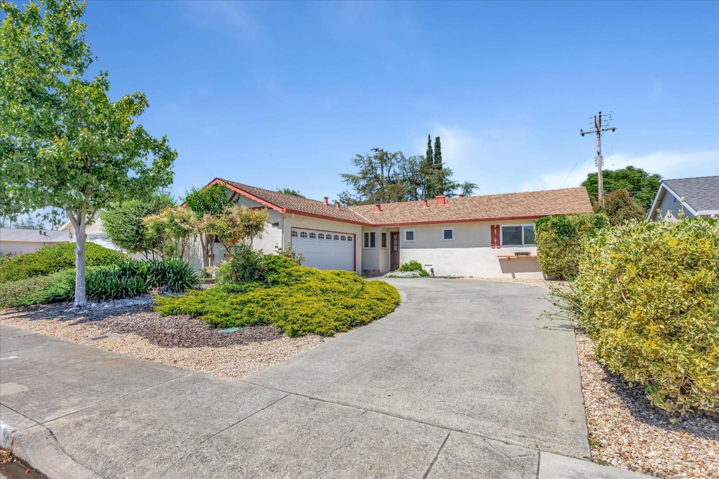 a front view of a house with garden