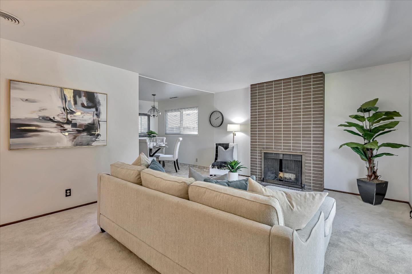 126 Brian Lane Santa Clara, CA 95051 - Photo 3 of 21 a living room with furniture a fireplace and a potted plant